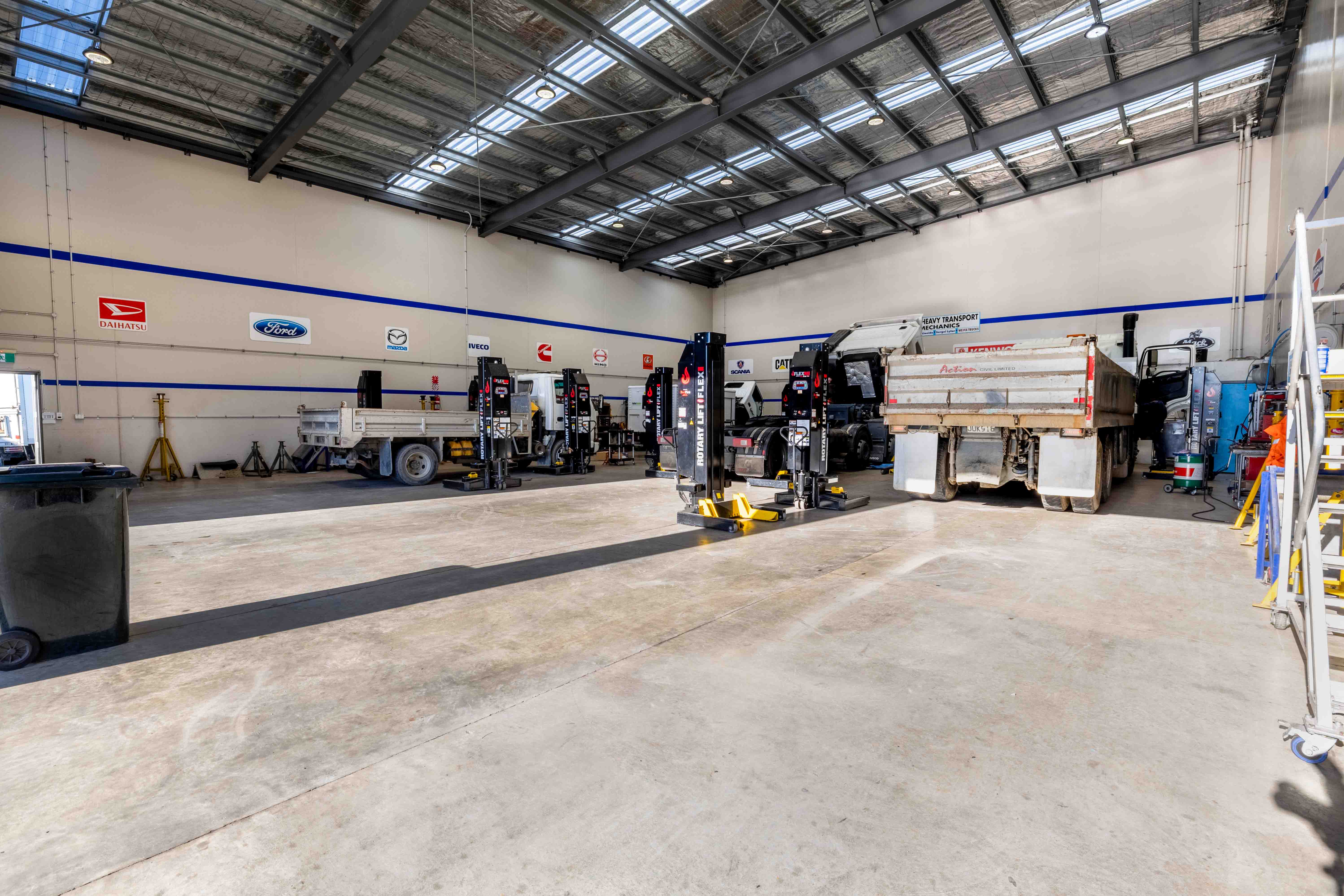 North City Diesel secondary building inside workshop with Action Civil Truck